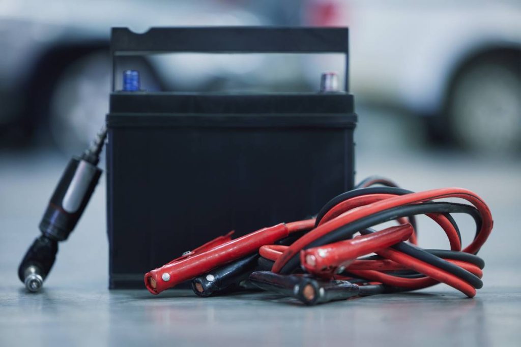 No car can run without it. Shot of a lead-acid battery on the floor of a car service center