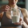 young-woman-in-sportswear-preparing-cooking-cockta-2024-03-08-16-54-28-utc (1)