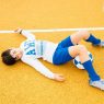 Soccer player boy lying on the court