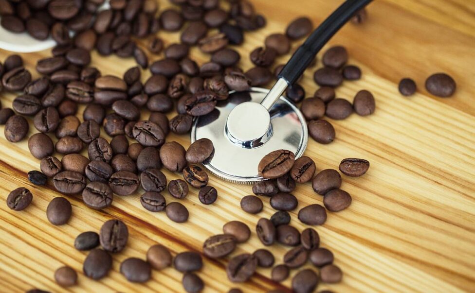 Good Morning. Paper Coffee Cup With Coffee Bean on The Wooden Table