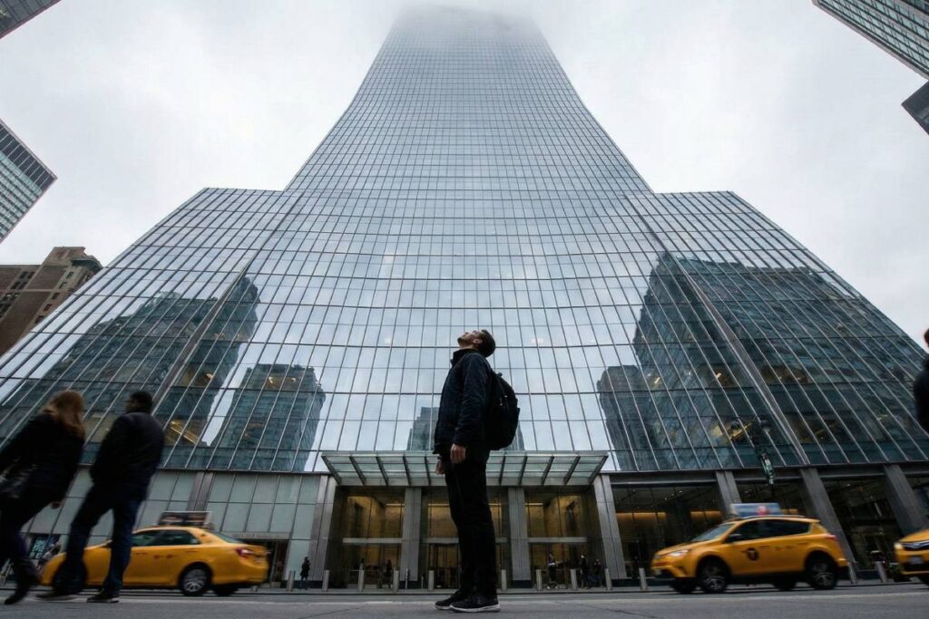 Person looking up at skyscraper illustrating batophobia triggers